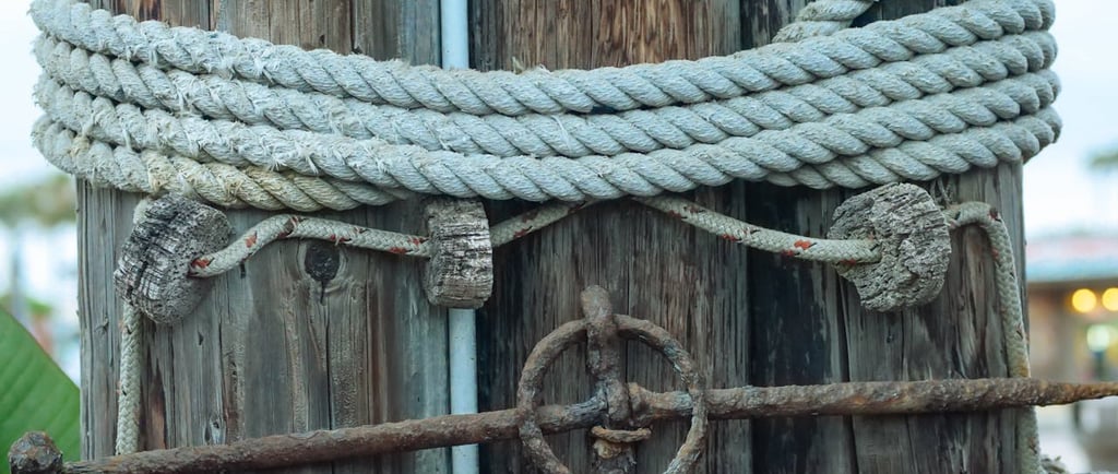 Photo by Kindel Media: https://www.pexels.com/photo/close-up-of-an-anchor-rope-on-a-wooden-block-835