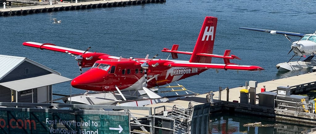 Photo by The Six: https://www.pexels.com/photo/red-seaplane-docked-at-vancouver-harbor-34875613/