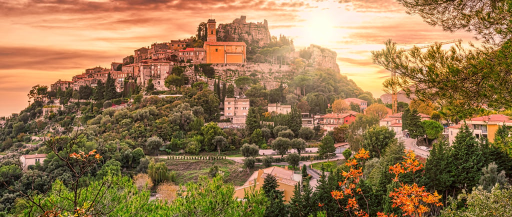 Panoramic sunset view of Eze village, a historic hilltop medieval town on the French Riviera.