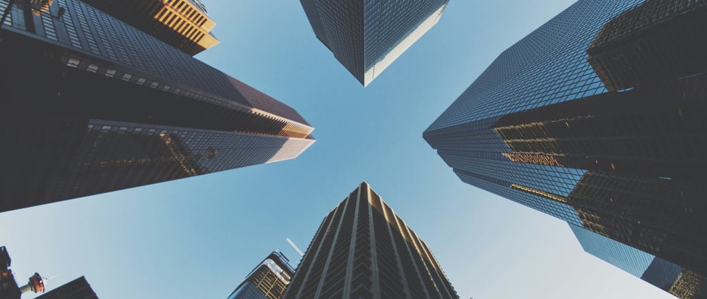 Upward view of tall modern office buildings in an international business district