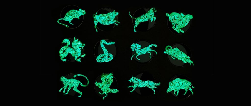 a collection of green glow - up animal figure pins
