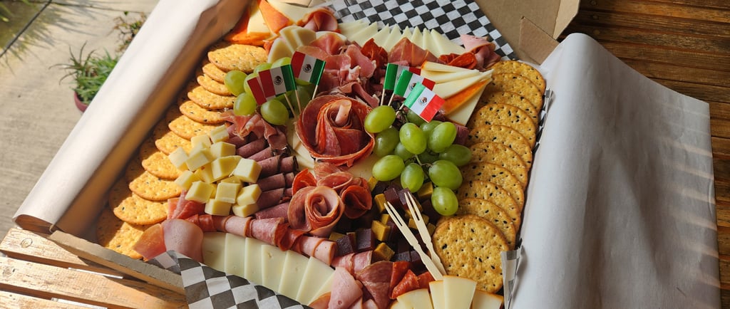 a box of cheese, meat and crackers in a box