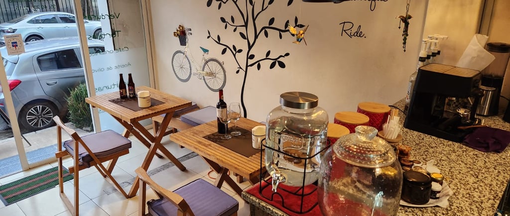 a table with a wine bottle and a glass of wine