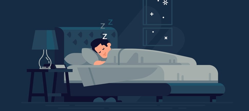 a man sleeping in a bed with a pillow and a lamp