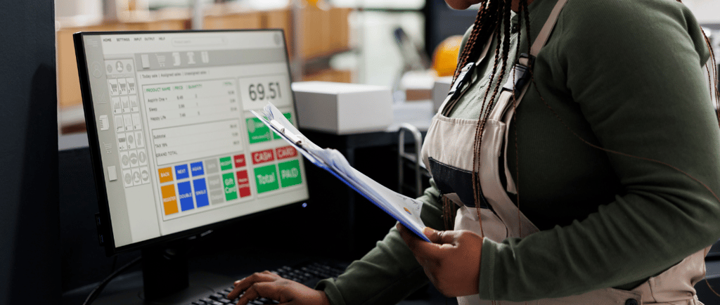 woman using computer tracking inventory