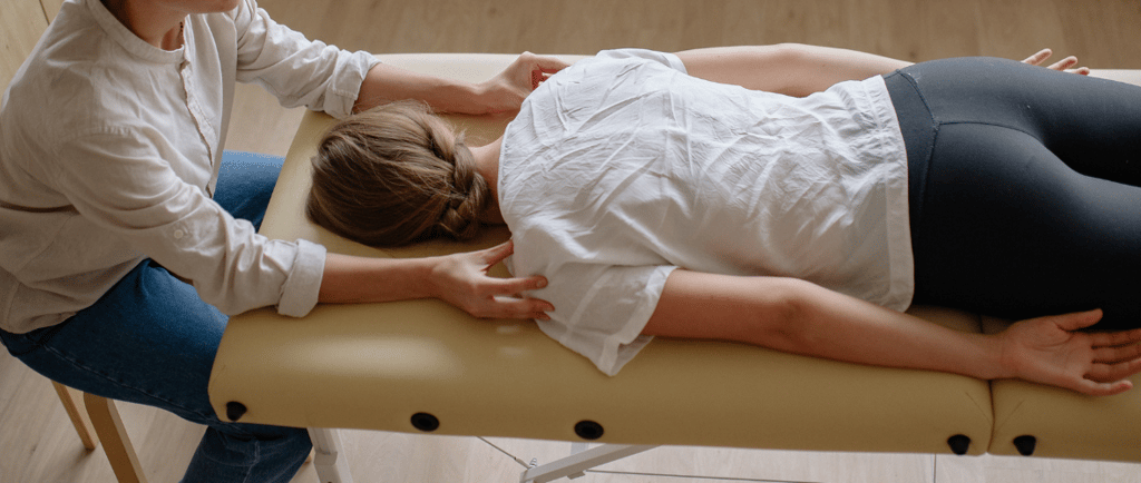 a woman at the chiropractor on a table