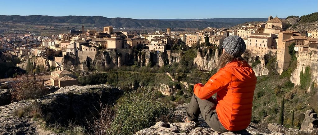 inspirella sitting on the rocks, overlooking Cuenca in Spain