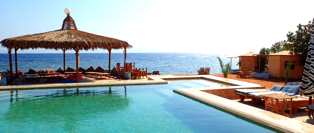 Sun playing with the sea and the pool in the winter