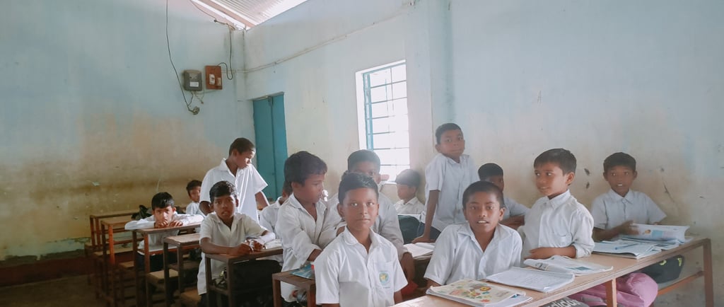 a group of children sitting at desks in a classroom