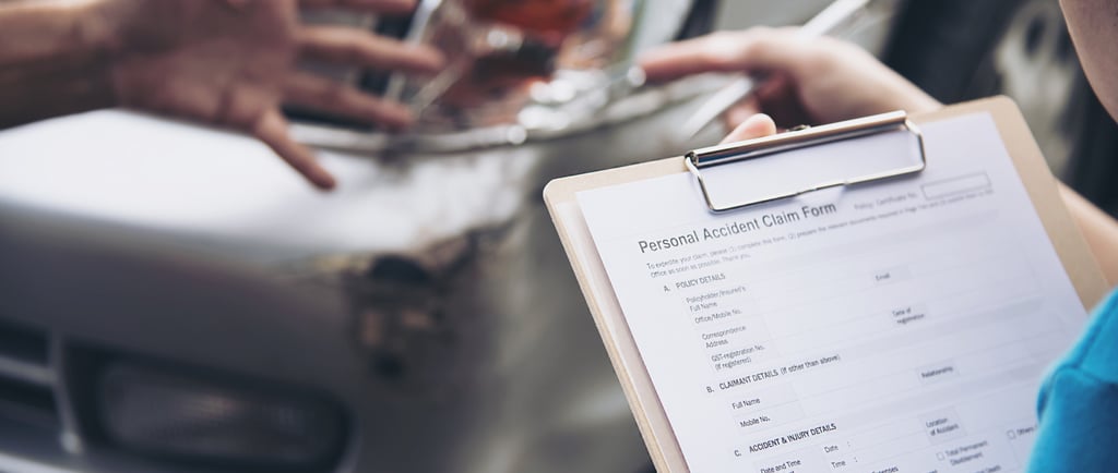 a person holding a clipboard with a clipboard attached to it discussing about an accident