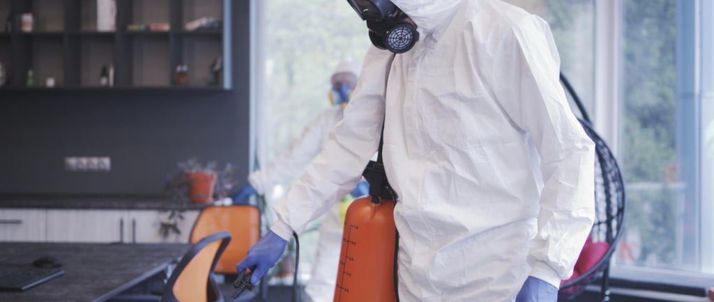 a man in a white suit and a gas canister