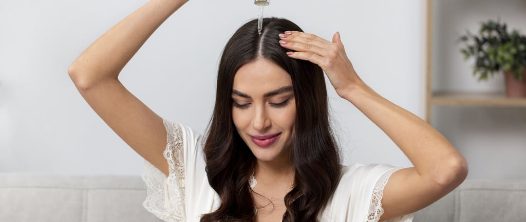 applying hair growth serum