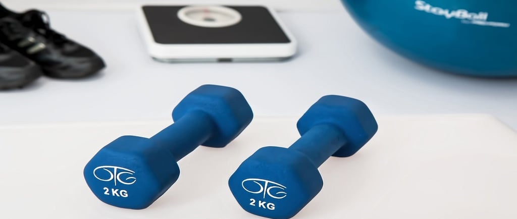 Dumbbells and weighing scale