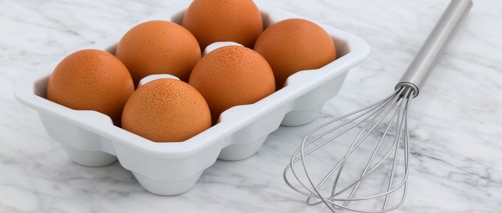 Eggs in a tray with a whisker