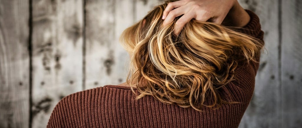 Girl holding her hair