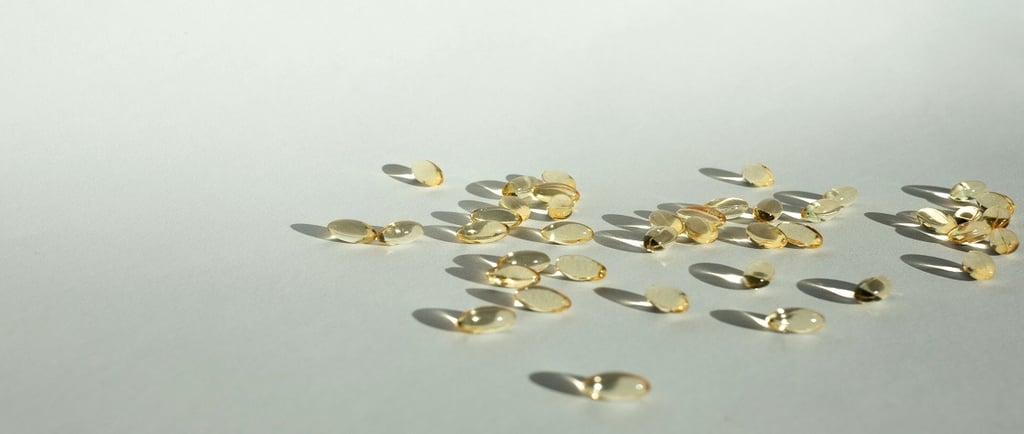Sunshine falling on capsules on a white surface