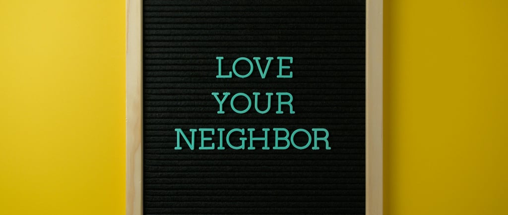 a blackboard with the words love your neighbor
