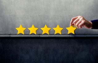 a person holding a starfish in front of a five star rating rating rating rating