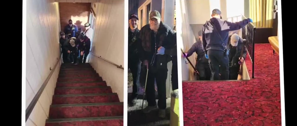 Local firefighters in uniform delivering a steak dinner from The Hammond Steak House to a veteran in