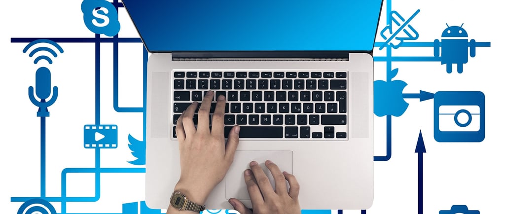 someone using a laptop with different app icons underneath connect with lines and arrows