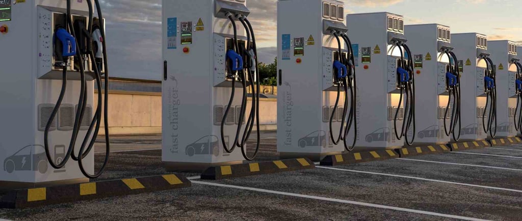 a row of fast electric charging stations in a parking lot