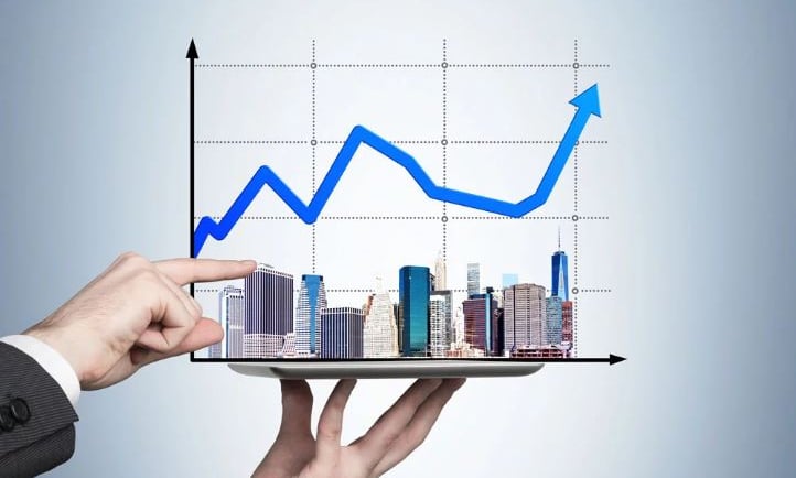 a person holding a tablet with a graphing graphing on it