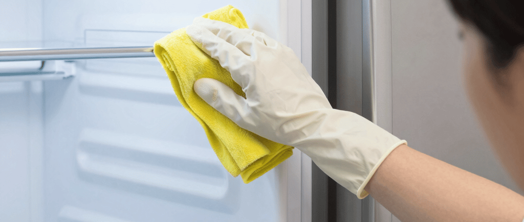 A pair of gloves sitting on top of a wooden floor