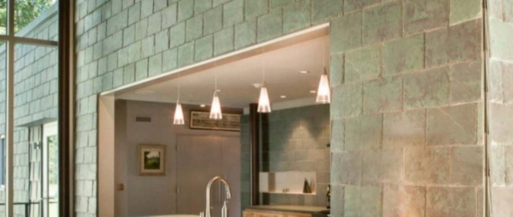 Manrise Enterprises - Modern kitchen with a natural stone wall design 