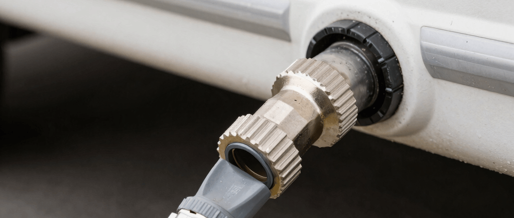 a hose connected to a mailbox in front of a trailer