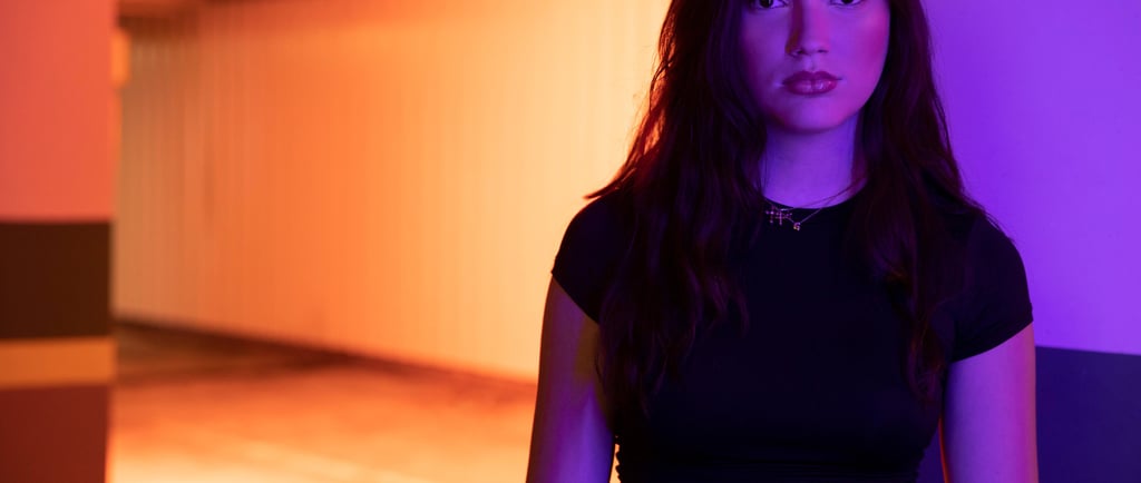 girl in neon light fitness studio