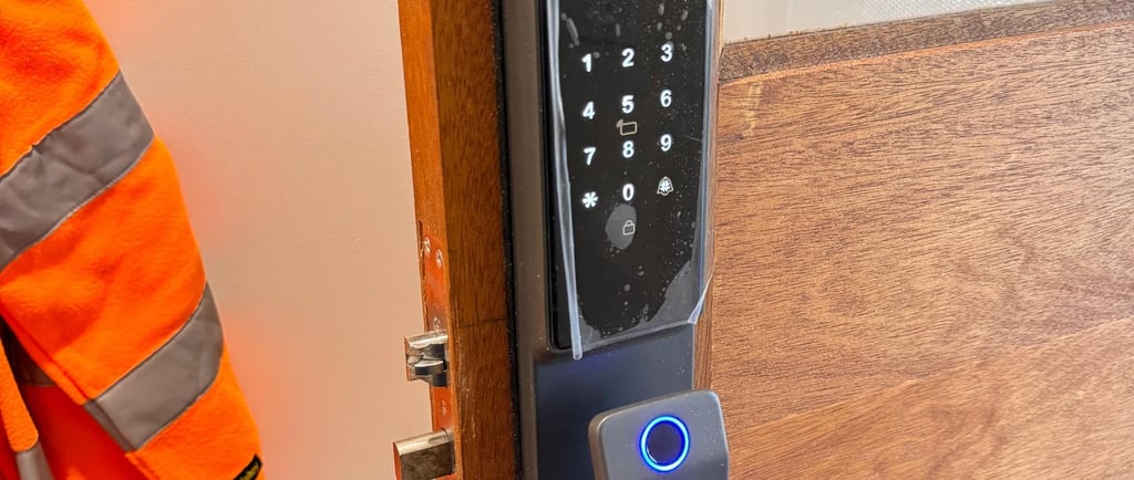 Professional locksmith installing a IPM016 smart door lock on a wooden door in Melbourne – Ipsum