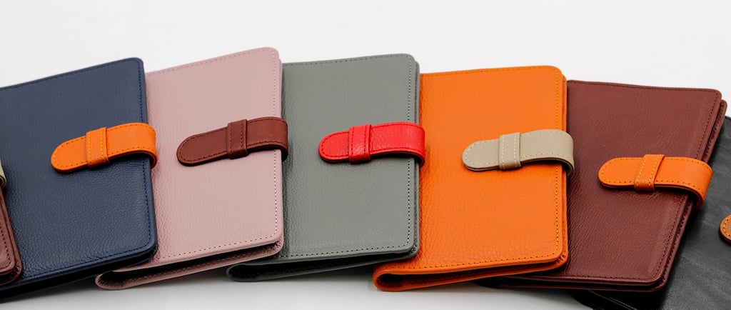 a group of four leather wallets with a leather case