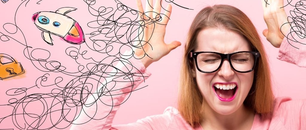 a woman with glasses and a pink shirt is holding her hands up and looking at