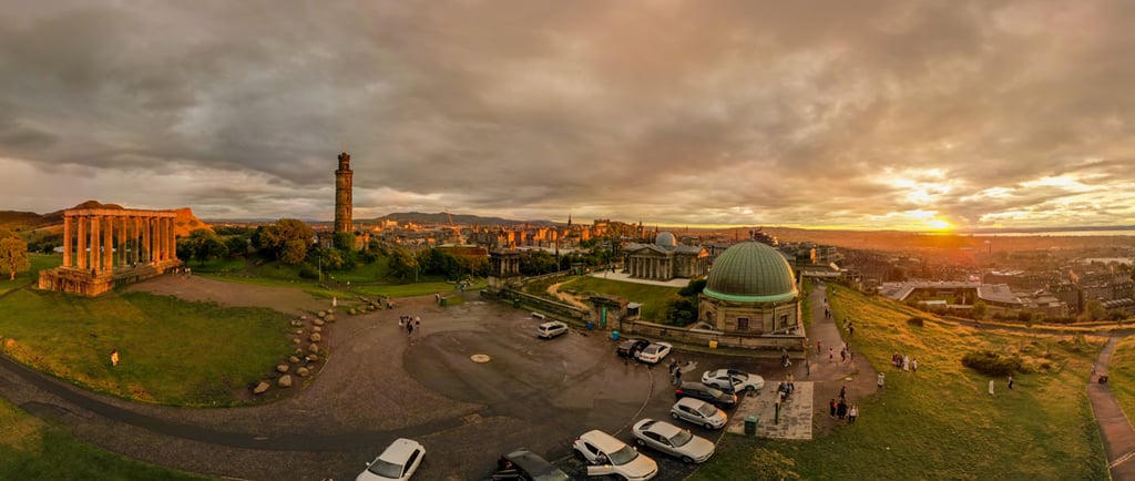 Calton hill at sunset with golden glow across the city of Edinburgh