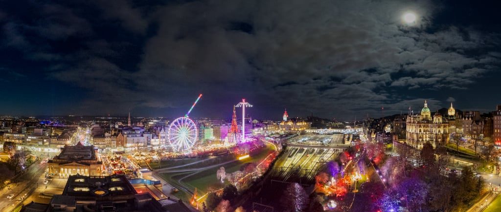 Edinburgh christmas market showing full moon over wavery station and the edinburgh market