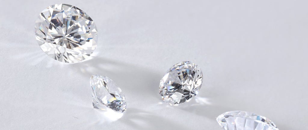 a group of three lab grown diamonds