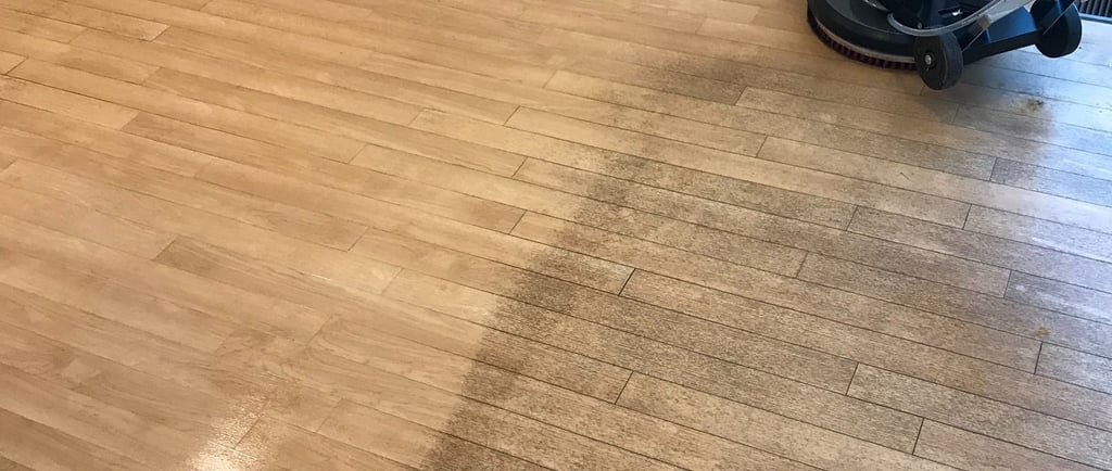 "Photo of a job in progress of a dirty vinyl floor in a small office in Daytona Beach, FL."