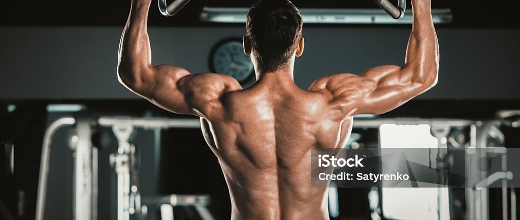 a man doing pull ups on a pull up barbell