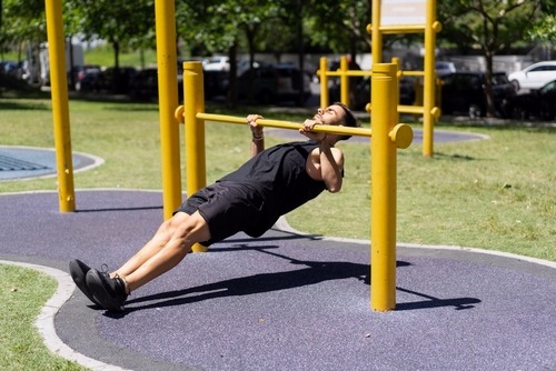 a man doing an inverted row exercise