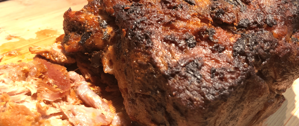 garlic citrus pork butt with crusty top and juice on bottom