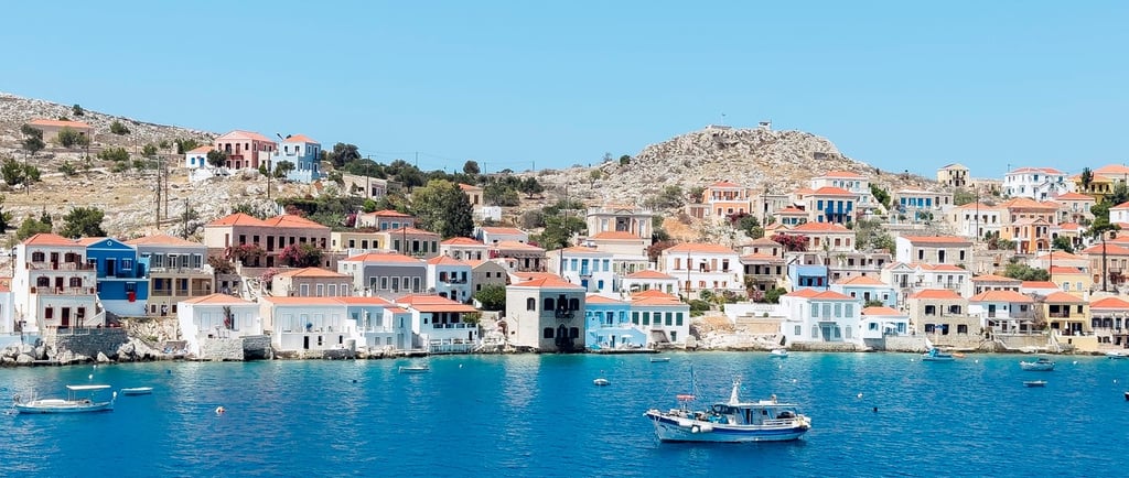 a boat in the water on the port of the Greek island Chalki