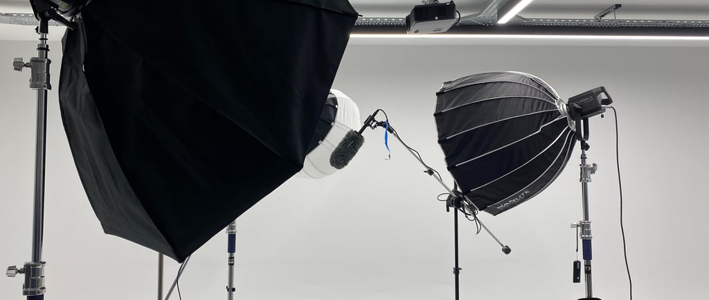 Professional photography studio setup with softbox lights and Godox strobes on stands.
