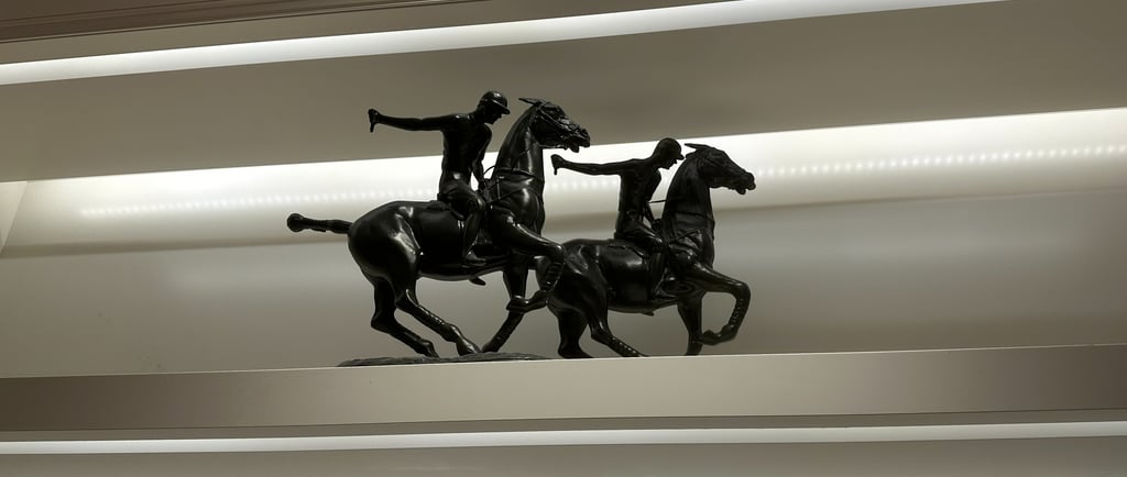 a statue of a man riding a horse
