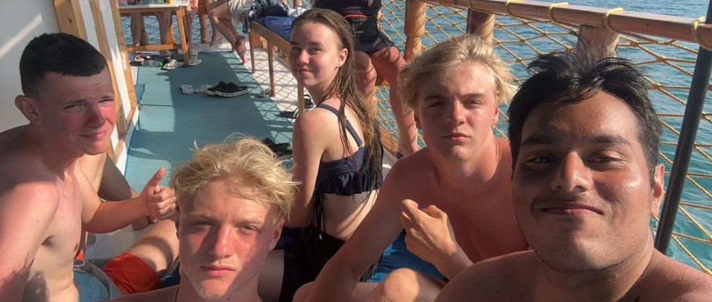 a group of people sitting on a boat