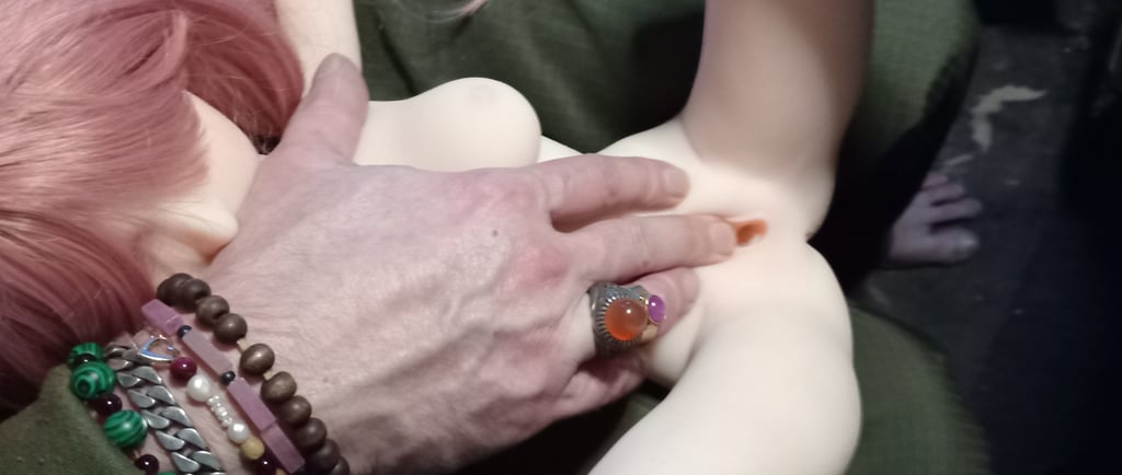 a mini sex doll being used