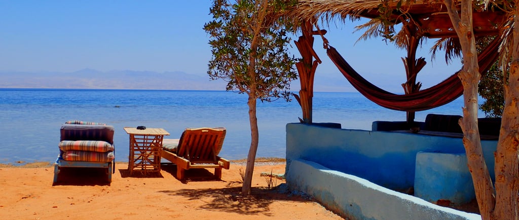beachview with chaise lounge and bungalow in front of the sea Bedouin star Egypt