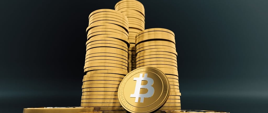 a stack of gold bitcoin coins with a bitcoin bitcoin