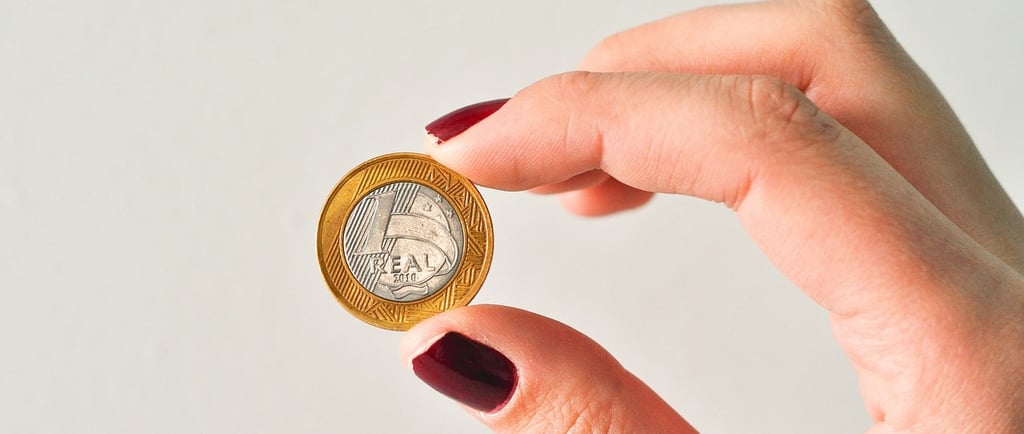 a person holding a coin with a coin