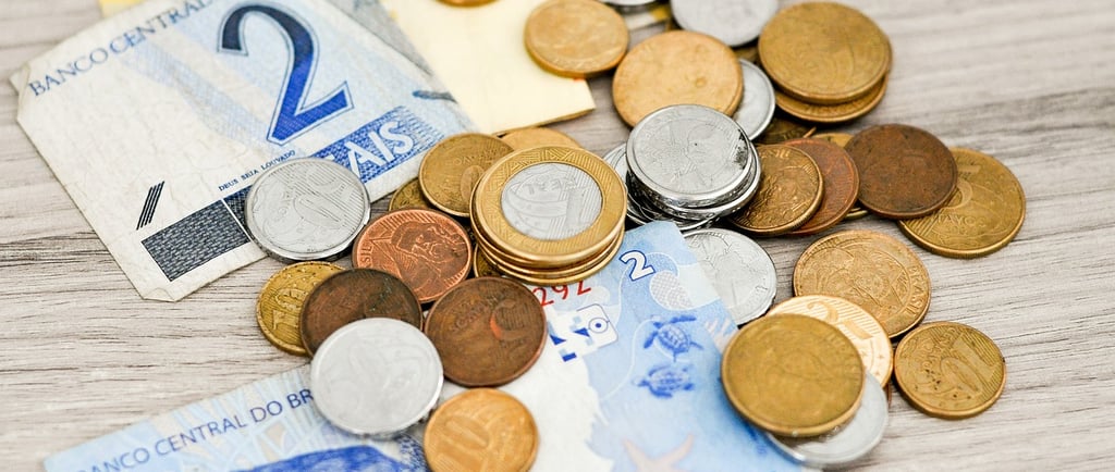 a bunch of cash and coins on a table