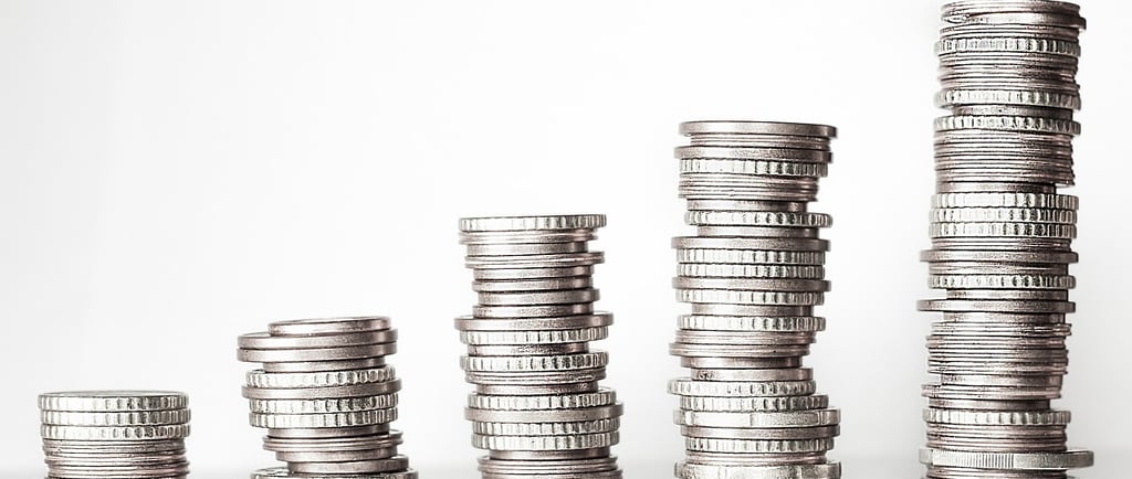 a stack of coins sitting on top of a pile of coins